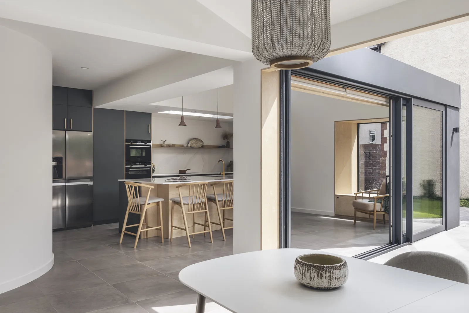 Curve House: View across dining to kitchen