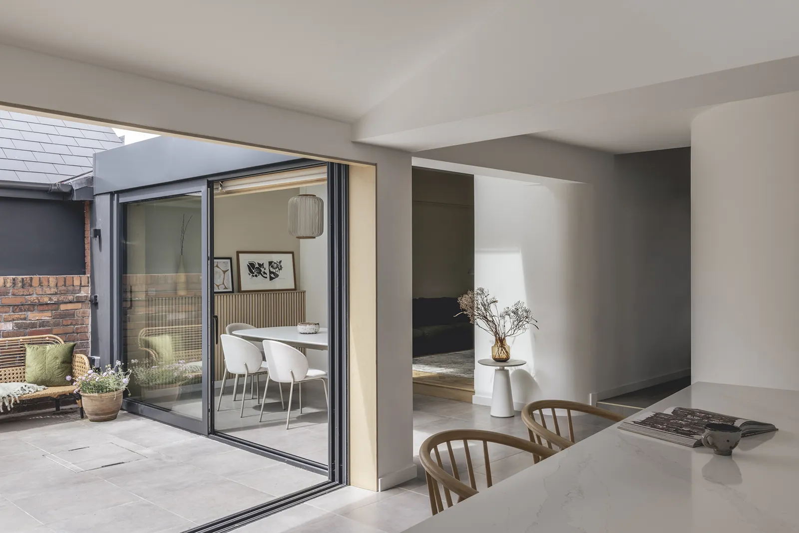 Curve House: View across kitchen to dining space