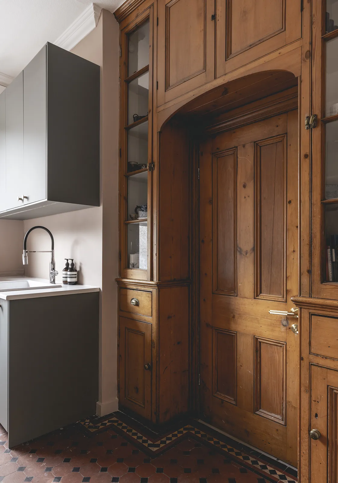 Curve House: Original door and storage in utility space to wc